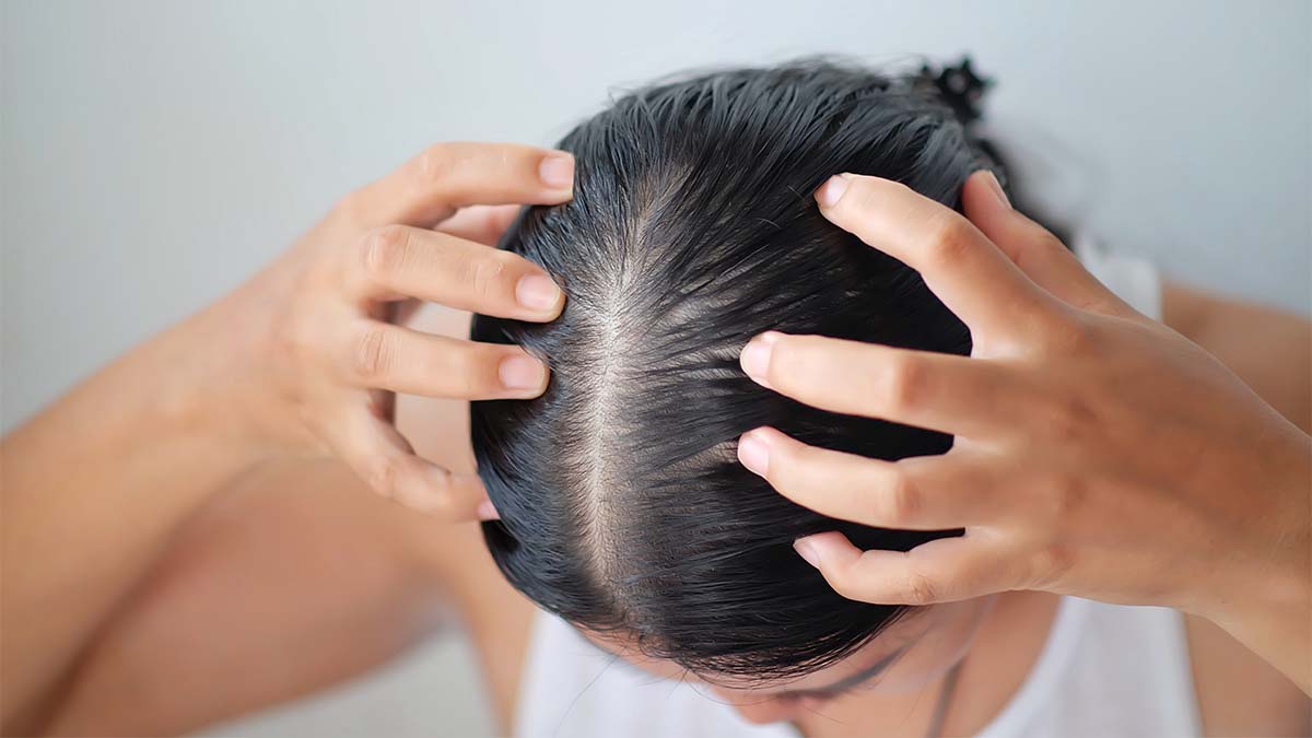 Woman-massaging-her-scalp.jpg